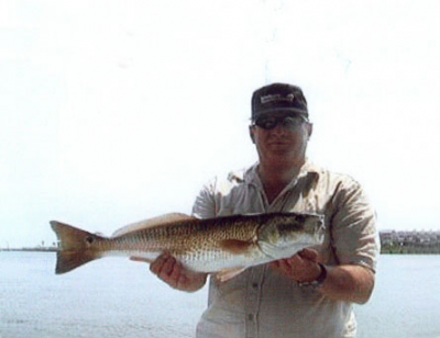 Former Kure Beach Police Officer Mike Tanner with a nice Red Drum.