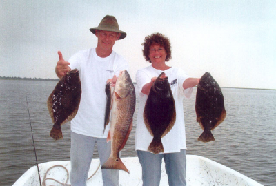 Greg and Denise from Pine Hurst, NC caught these nice flounder and red drum aboard Affordable Charters.