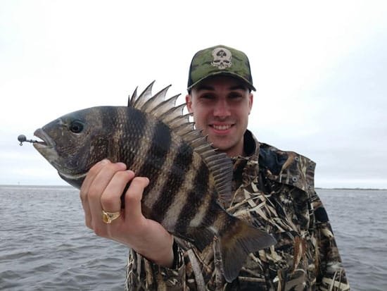 Seahawk Inshore Fishing Charter happy landing a sheepshead