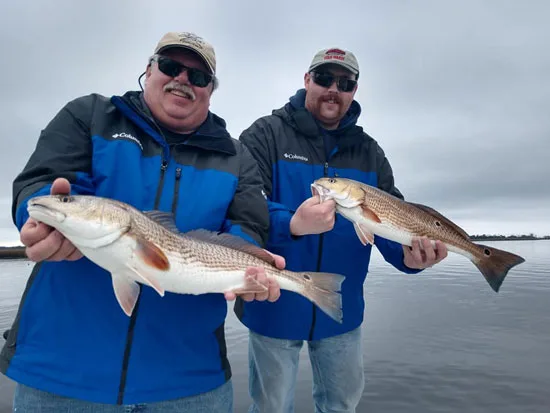 Seahawk Inshore Fishing Charters 2 guys with nice reds
